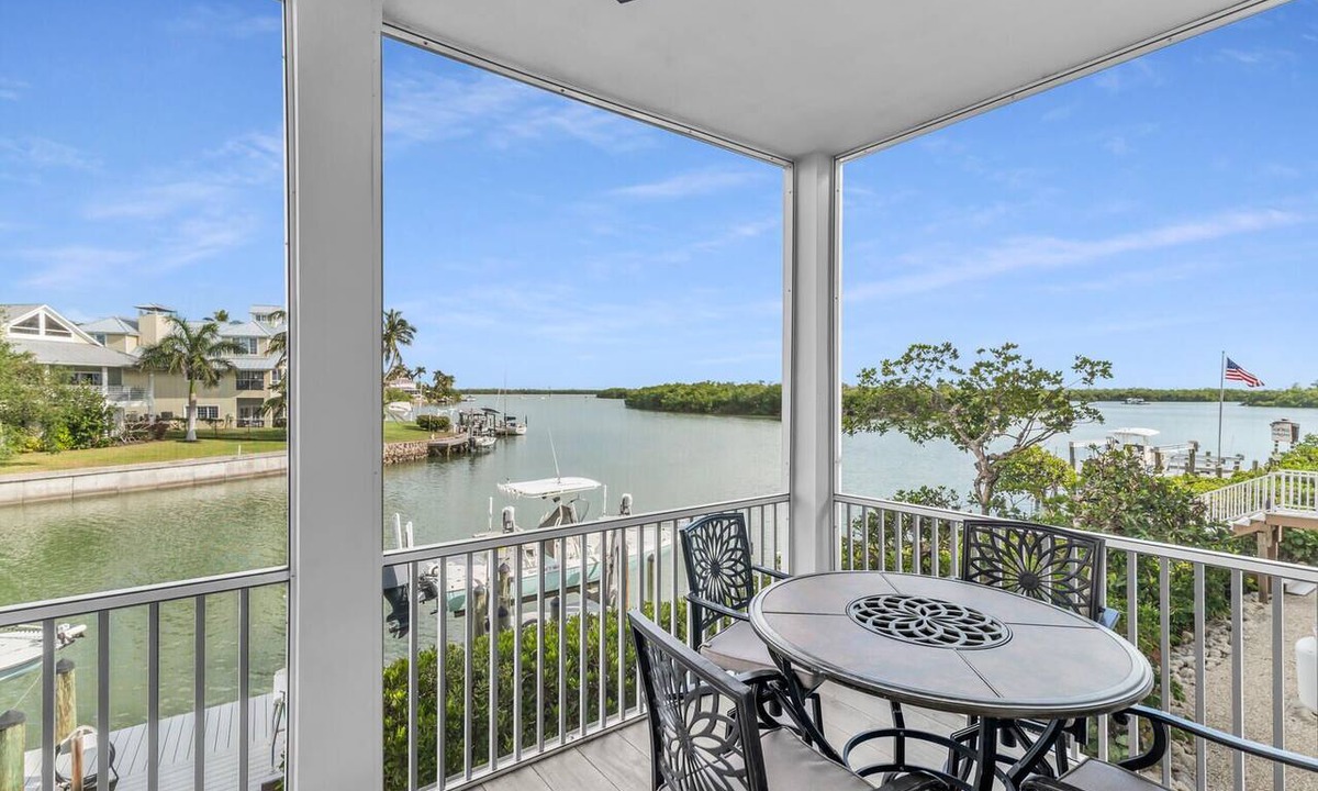 Goodland Condo | Elegant Coastal Townhouse with Panoramic Water Views