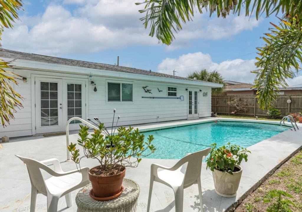 Interchange Square Apartment | Gorgeous four bedroom pool home in Palm Bay