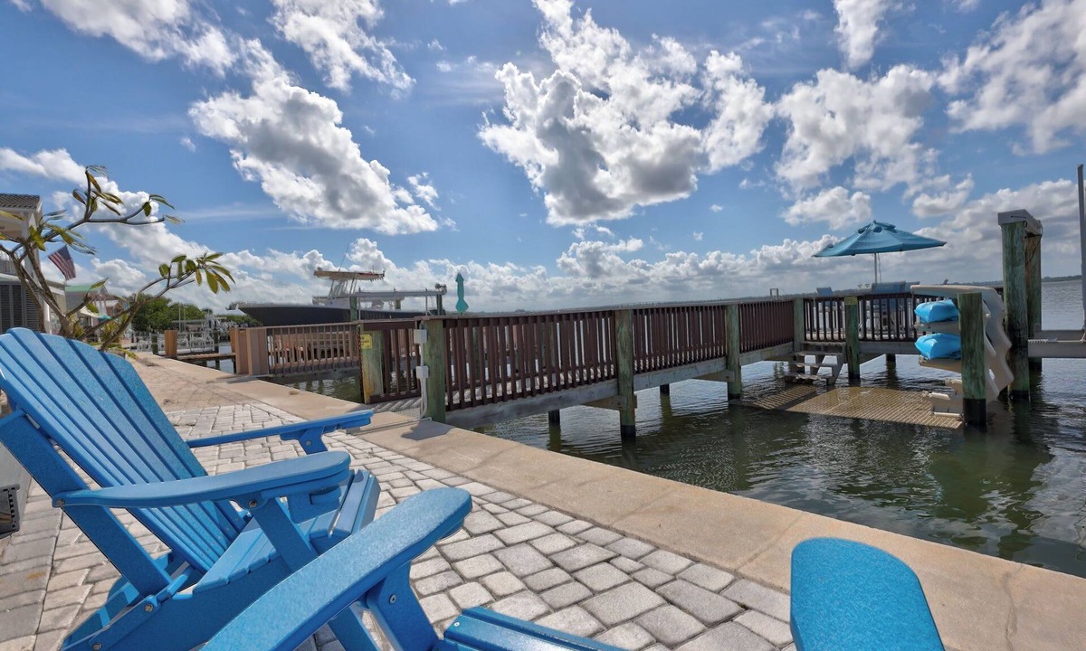 Hutchinson Island South Cottage | Nettles Island Waterfront with Dock & steps from Beach-plus Golf Cart Credit