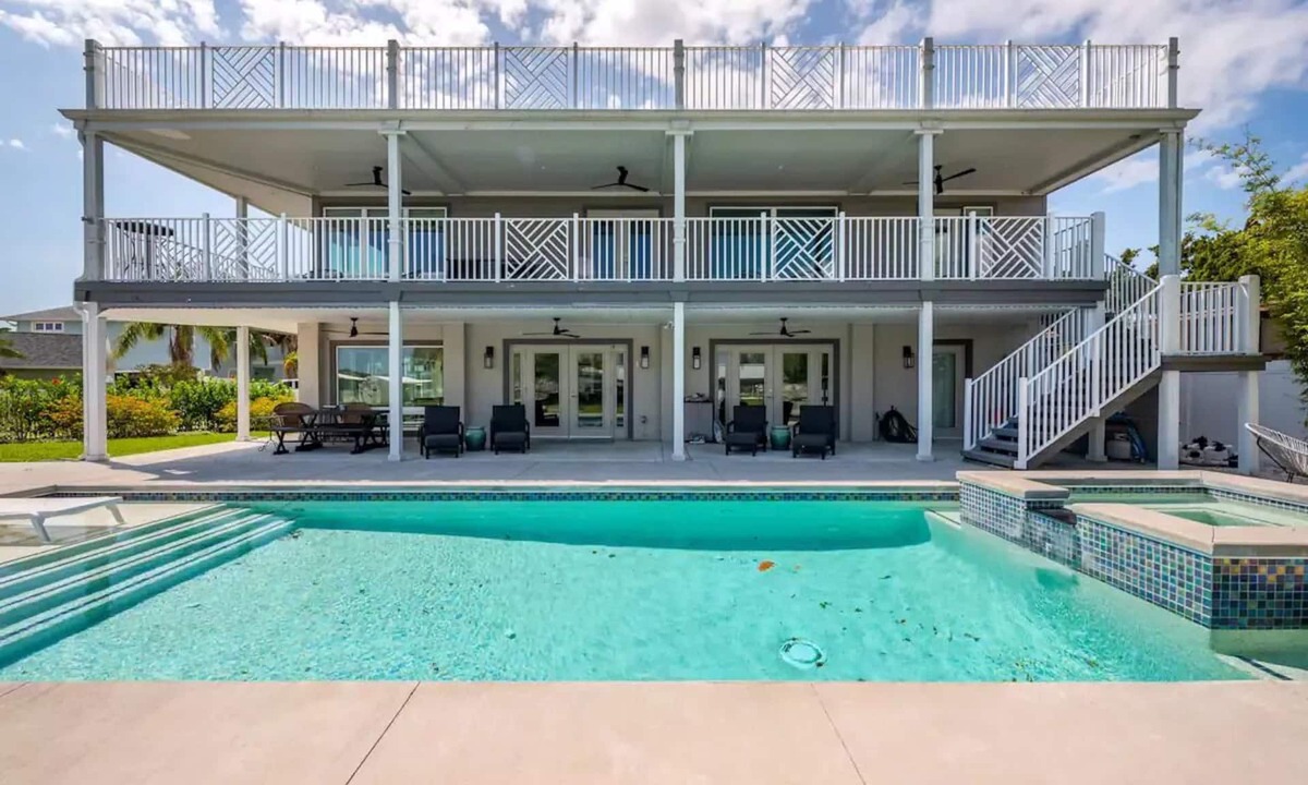 Indian Harbor Estates House | Stunning Luxury Riverfront Pool Home with Boat Dockage