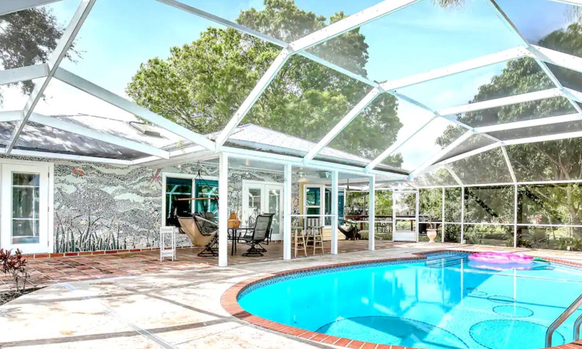 Sebastian Highlands House | Tropical Oasis on double lot w/Pool, Pond, King Bed & Mosaics- Pet Friendly!
