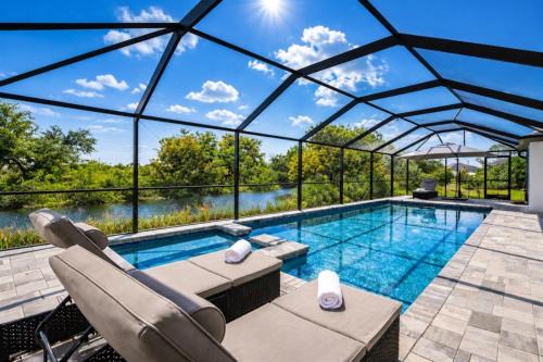 Mariner Villa | Villa Capeside Waterfront Home with Heated Pool & Spa