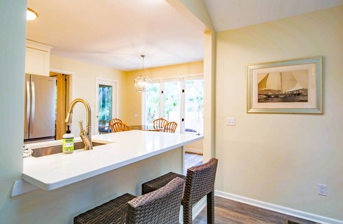 West Beach House | 10 Minute Walk to Beach! Two Primary Suites, Bunk Bedroom, Den with Pool Table, Expansive Back Porch