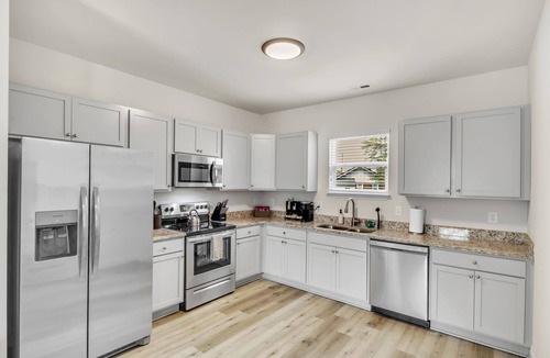 Greer House | 2BR Greer Condo: Pet-Friendly, King Beds, Fire Pit