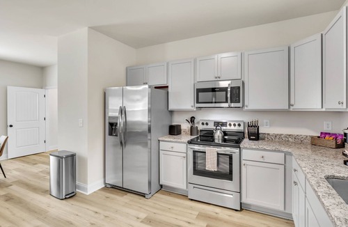 Greer House | 2BR Greer Condo: Pet-Friendly, King Beds, Fire Pit