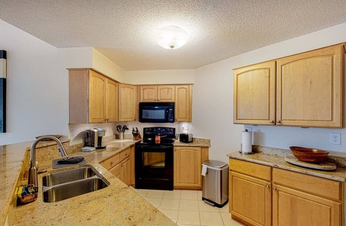 Isla del Sol Condo | 2nd Floor Condo Overlooking Country Club Greens w Free WiFi AC and Shared Pool