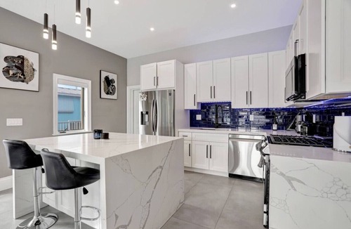 South New River Isles House | 3BR Waterfront Villa with Heated Pool, Spa, & Rooftop Deck