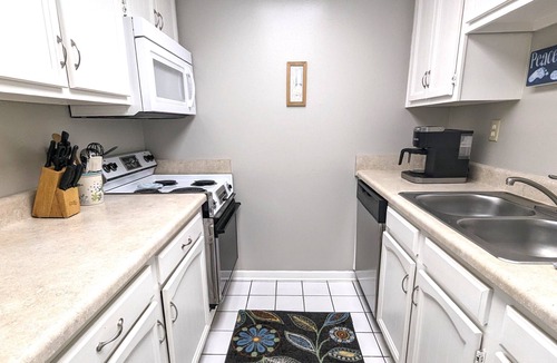 Avon By The Sea Condo | Affordable ONE BR Main Floor Condo RIGHT ON THE BEACH - KING Bed & Heated POOL!