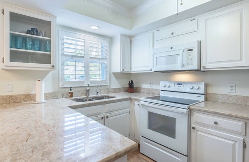 Moorings Condo | Approx 1 mile to the beach! West of 41 condo with pool and hot tub!