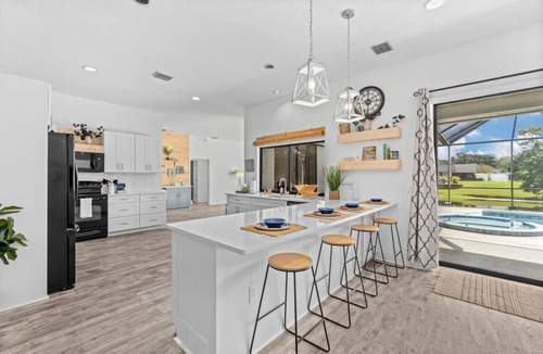 Palma Sola House | Bradenton Canal Home w/Private Pool, Hot Tub, Pac-Man Arcade & Canal Fishing