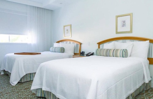City Center Hotel | Breathtaking Getaway w/Kitchenette, Pool, Walk to Ocean & Local Vibes