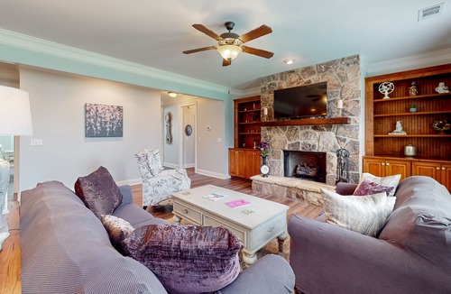 Riverwood Plantation House | Champions Retreat | Dog-friendly home with fireplace, grill, and sunny patio