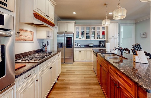 Riverwood Plantation House | Champions Retreat | Dog-friendly home with fireplace, grill, and sunny patio