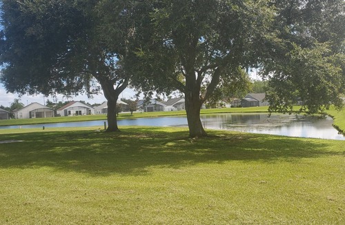 Crescent Lakes House | Charming 3-bedroom house with WiFi, AC, Pool, Lake View, by Disney.