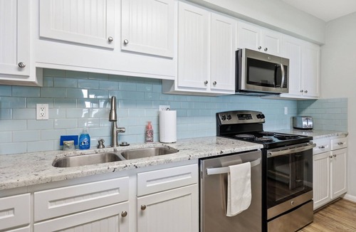Indian Beach Condo | Colony By The Sea Condo 2BR/2BA with ocean views, direct beach access, community pool, hot tub, elevator & private balcony. Enjoy a king ensuite & guest room with bunk bed and full size guest bed. TV's in each room, full kitchen, washer/dryer.