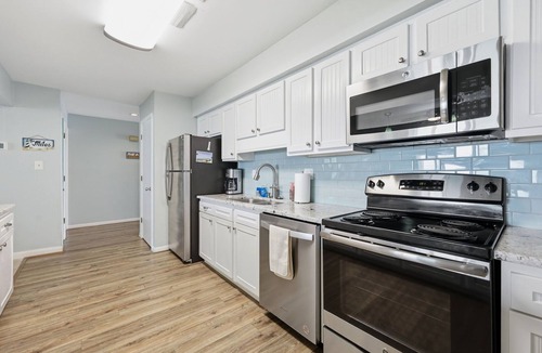Indian Beach Condo | Colony By The Sea Condo 2BR/2BA with ocean views, direct beach access, community pool, hot tub, elevator & private balcony. Enjoy a king ensuite & guest room with bunk bed and full size guest bed. TV's in each room, full kitchen, washer/dryer.