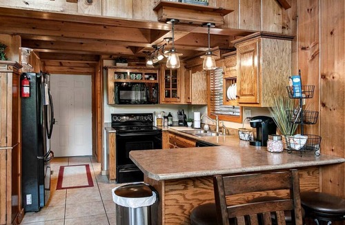 Flat Hollow Marina Cabin | Deluxe Cabin with Three Stunning Decks for a Group Getaway on Norris Lake, Tennessee