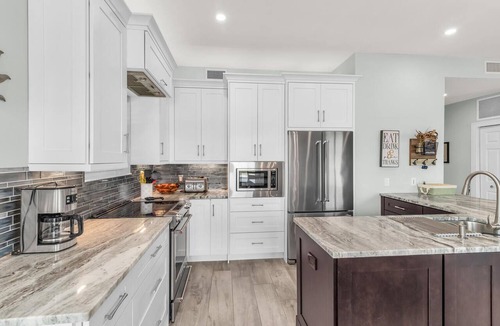 Goodland Condo | Elegant Coastal Townhouse with Panoramic Water Views