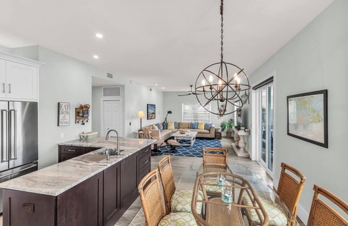 Goodland Condo | Elegant Coastal Townhouse with Panoramic Water Views