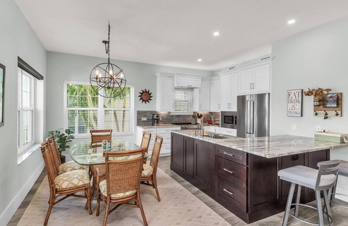 Goodland Condo | Elegant Coastal Townhouse with Panoramic Water Views