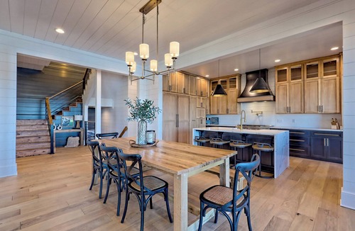 Elf House | Endless Sunsets by Chatuge Home Concierge | Lakefront home with private dock, covered boat slip, sun deck, hot tub, bar, fire pit, pool table, kayaks and EV charger. The perfect spot to relax, play, and enjoy unforgettable sunset views.