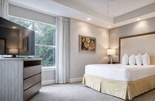 West Kissimmee Hotel | Enjoy Scenic Views from a Stylish Condo in a Relaxing Retreat | Outdoor Pool