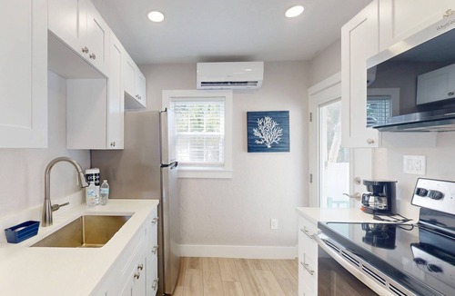 Madeira Beach Cottage | Entire Island Paradise Cottages – Heated Pool, Tiki Hut, Walk to Beach, 8 Units, Sleeps 30