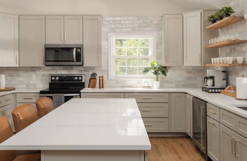 Northwest Raleigh House | Experience an elevated group getaway in this renovated 3,100 sqft, 5-bdrm 3 bth. Perfect for families, it features a massive 900 sqft game room with a pool ping pong table, wet bar, & much more. Enjoy a luxurious stay with hotel-style amenities.