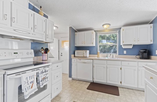 Greenwood House | Family - Friendly Lakefront Home with a Covered Boat-slip.
