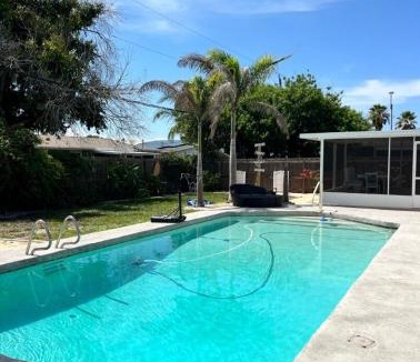Interchange Square Apartment | Gorgeous four bedroom pool home in Palm Bay