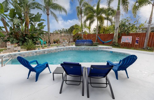 Tropic House | Gorgeous Urban Oasis w/Hot Tub, HEATED POOL and Private Movie Theater by RedAwning