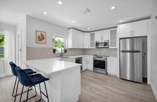 Poinsettia Heights Villa | Heated pool, 2 miles from Beach! Updated home: BBQ, large backyard, comfy beds