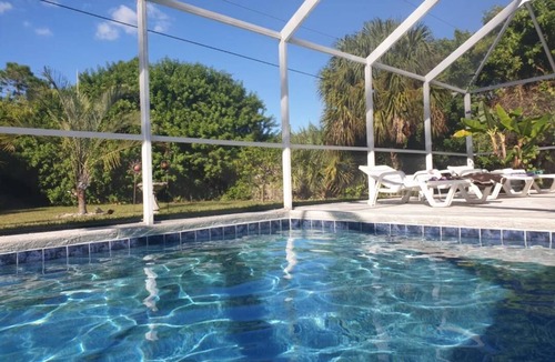 Port Charlotte Villa | Holiday villa with an extra large heated private pool and terrace area