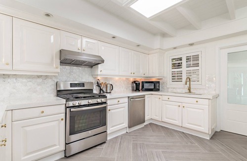 Central Beach House | Home Gem! Heated pool, lush backyard a block from the ocean on Central Beach!