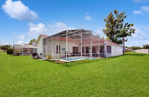 Westridge House | Home near Disney/golf with screened pool, spa, pool table, foosball, AC, and W/D