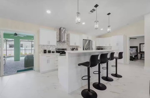 Mariner House | Home with heated pool and a pool table in Cape Coral