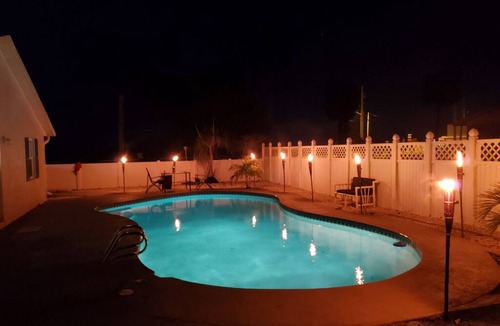 Micco House | Indian River Waterfront Home with private dock, heated pool, fenced back yard