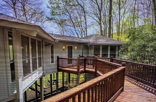 Topton Cabin | Lake Nantahala Lakefront Treehouse with private dock and hot tub.