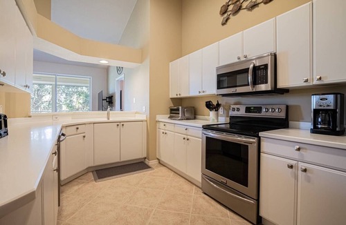 Flamingo Fairways Condo | Lely 2nd Flr Condo w/tranquil golf course views from private screened lanai; Players Club Option