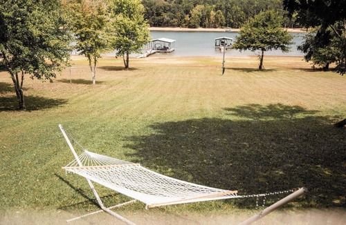Fair Play House | Light & Airy Lakefront Home with Flat Yard, Private Dock, Deck & Screened Porch