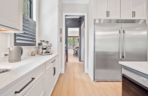 Plaza Midwood House | Luxurious Farmhouse w/firepit, outdoor entertaining area w/large tv and gym!