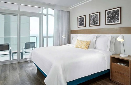 Downtown Myrtle Beach Hotel | Modern 2-Room Ocean View Suite with Balcony and Spacious Living Area
