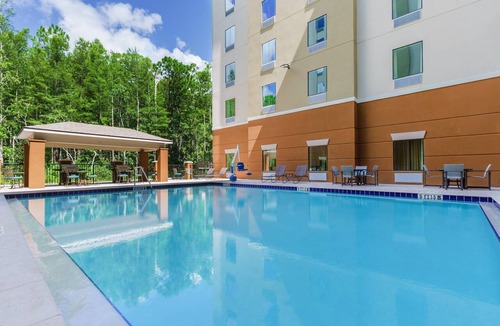 Florida Central Atlantic Coast Hotel | Modern Double Queen Studio | Kitchen & Grill | 3 mi to Typhoon Lagoon