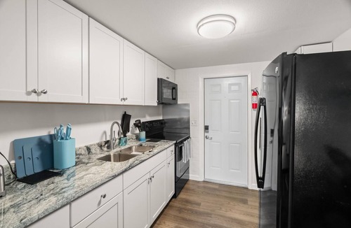 St. Petersburg - Clearwater Apartment | NEW Minutes to Downtown & Beach! Large Fenced Yard, Hammock, Fire Pit, Dining