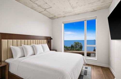 Downtown - Waterfront Apartment | One Bedroom King bedded room with direct views of Lake Superior