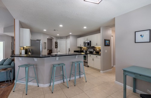 Vero Lake Estates House | ☆☀︎❀Palm Paradise! Heated Pool, Lanai with TV, Grill, & Fenced Yard!
