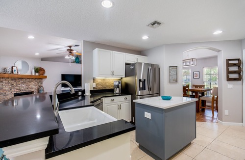 Vero Lake Estates House | ☆☀︎❀Palm Paradise! Heated Pool, Lanai with TV, Grill, & Fenced Yard!