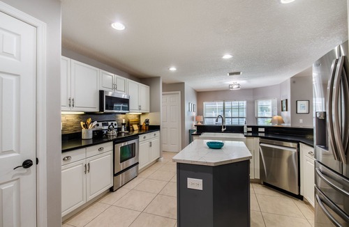 Vero Lake Estates House | ☆☀︎❀Palm Paradise! Heated Pool, Lanai with TV, Grill, & Fenced Yard!
