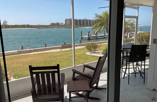 Isles of Capri Apartment | Paradise on the Isles - Stunning Waterfront Views - Pool & Dock Steps Away