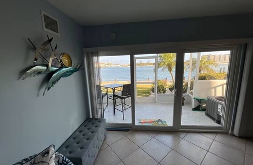 Isles of Capri Apartment | Paradise on the Isles - Stunning Waterfront Views - Pool & Dock Steps Away